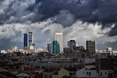 Modern buildings in city against sky