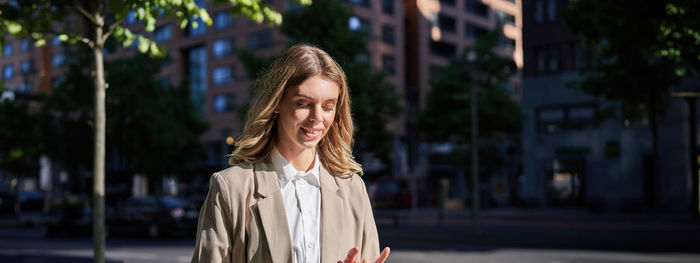 Young woman standing in city