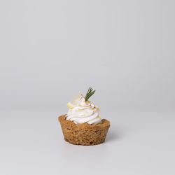 Close-up of cake against white background