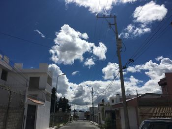 Buildings against cloudy sky