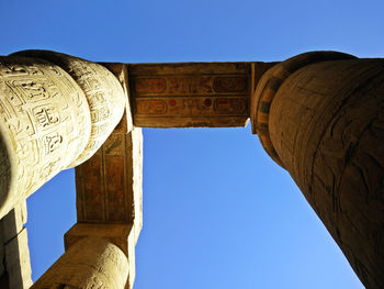 Low angle view of historical building against blue sky