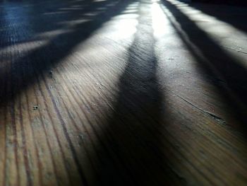 High angle view of shadow on hardwood floor