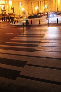 People walking in illuminated city at night