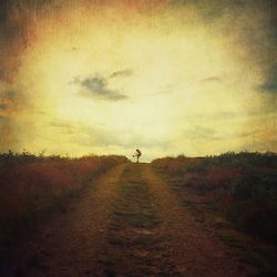 Man walking on dirt road