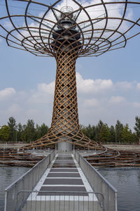 Low angle view of tower against cloudy sky