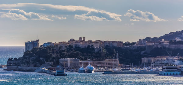 Boats moored at harbor