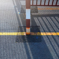 Low section of person crossing road
