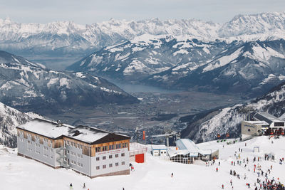 High angle view of buildings by snowcapped mountains