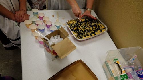 High angle view of woman preparing food on table