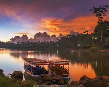 Scenic view of sunset over lake