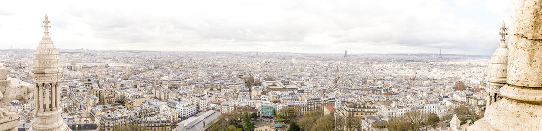 High angle view of city against cloudy sky