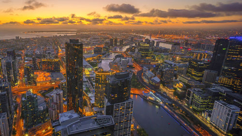 Aerial view of city during sunset