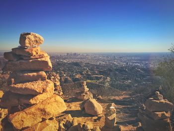 Panoramic view of rocks on landscape against clear sky