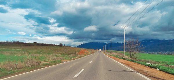 Road amidst landscape against sky