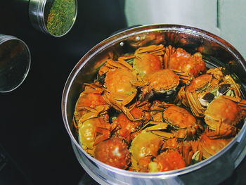 High angle view of cooked crabs in container