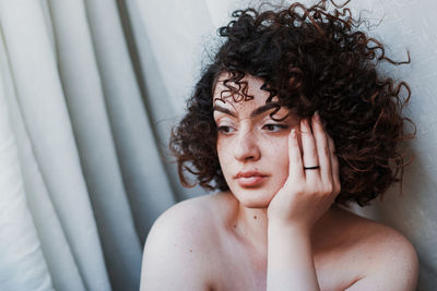 Portrait of young woman looking away