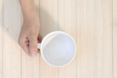 Directly above shot of empty coffee cup on table