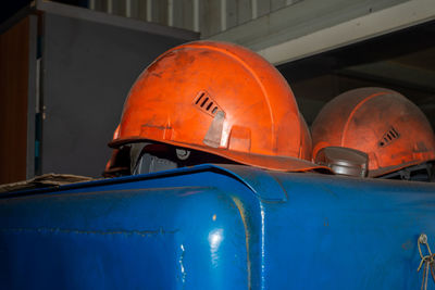 Dusty orange helmets. safety concept.