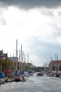 Boats moored at harbor