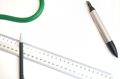 High angle view of pen on table against white background