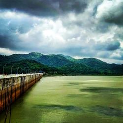 Scenic view of lake and mountains against sky