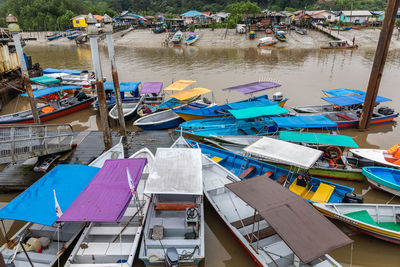 High angle view of boats moored at harbor