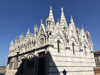 Low angle view of building against blue sky