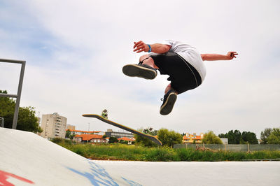 Man skateboarding at skateboard park