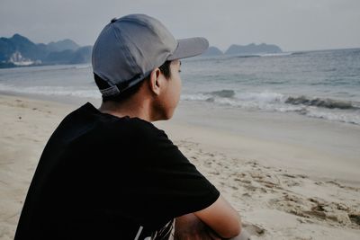 Close-up of young man at beach