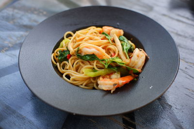 High angle view of pasta in plate on table