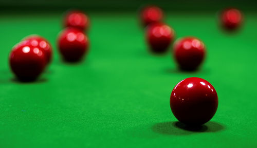 Close-up of red balls on pool table