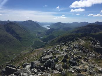 Scenic view of landscape and mountains against sky