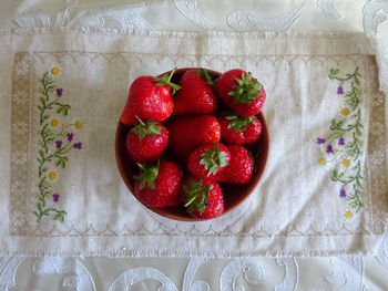 High angle view of strawberries in plate on table