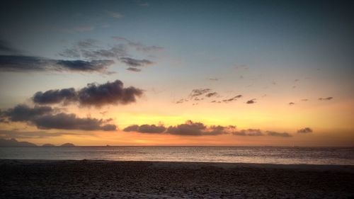 Scenic view of sea against sky at sunset