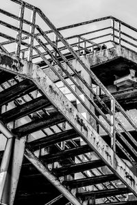 Low angle view of building under construction against sky