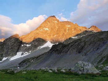 Scenic view of rock formations on landscape against sky