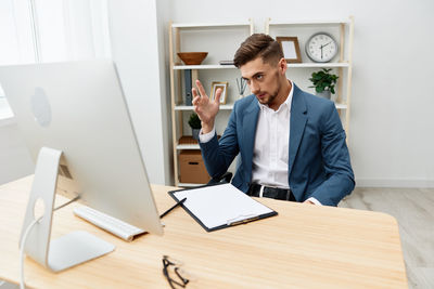 Portrait of businessman working at office