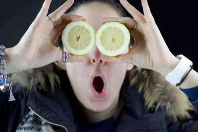 Close-up of hand holding fruits