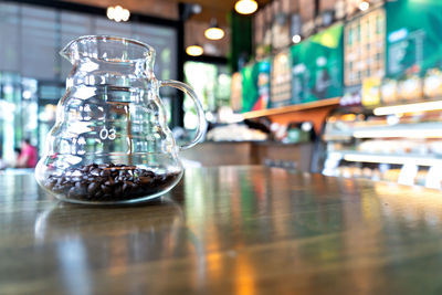 Close-up of glass jar on table at restaurant