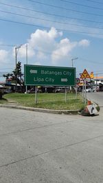 Road against cloudy sky