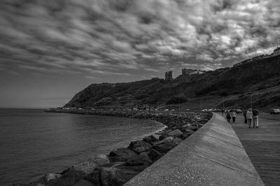 Scenic view of sea against cloudy sky