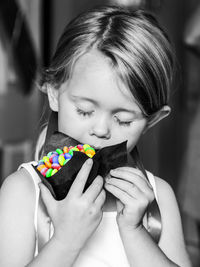 Portrait of girl holding toy