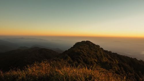 Scenic view of mountains against sky during sunset