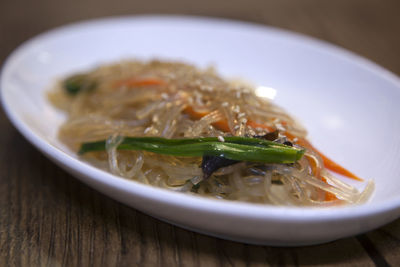 Close-up of noodle in bowl on table