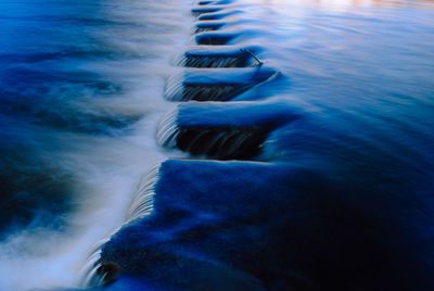 Blurred motion of rocks in sea