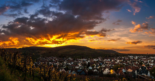 Panoramic shot of townscape against sky at sunset