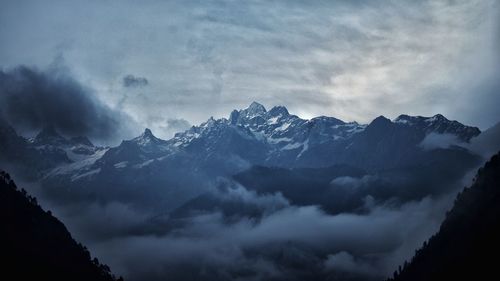 Scenic view of mountains against sky at night