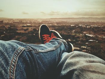 Low section of man wearing shoes