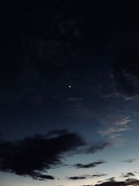 Low angle view of moon in sky at night