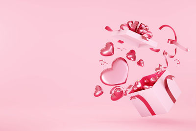 Close-up of pink over white background